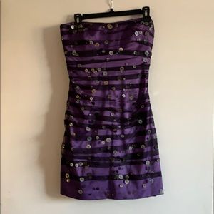 Purple dress with tulle and sequins detail.
